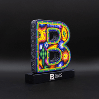 Custom-Colored 3D Wooden Letter with Inked Wood Engraving.