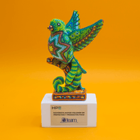 Resin quetzals on a white base.