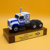 Resin truck tractor on a wooden base.