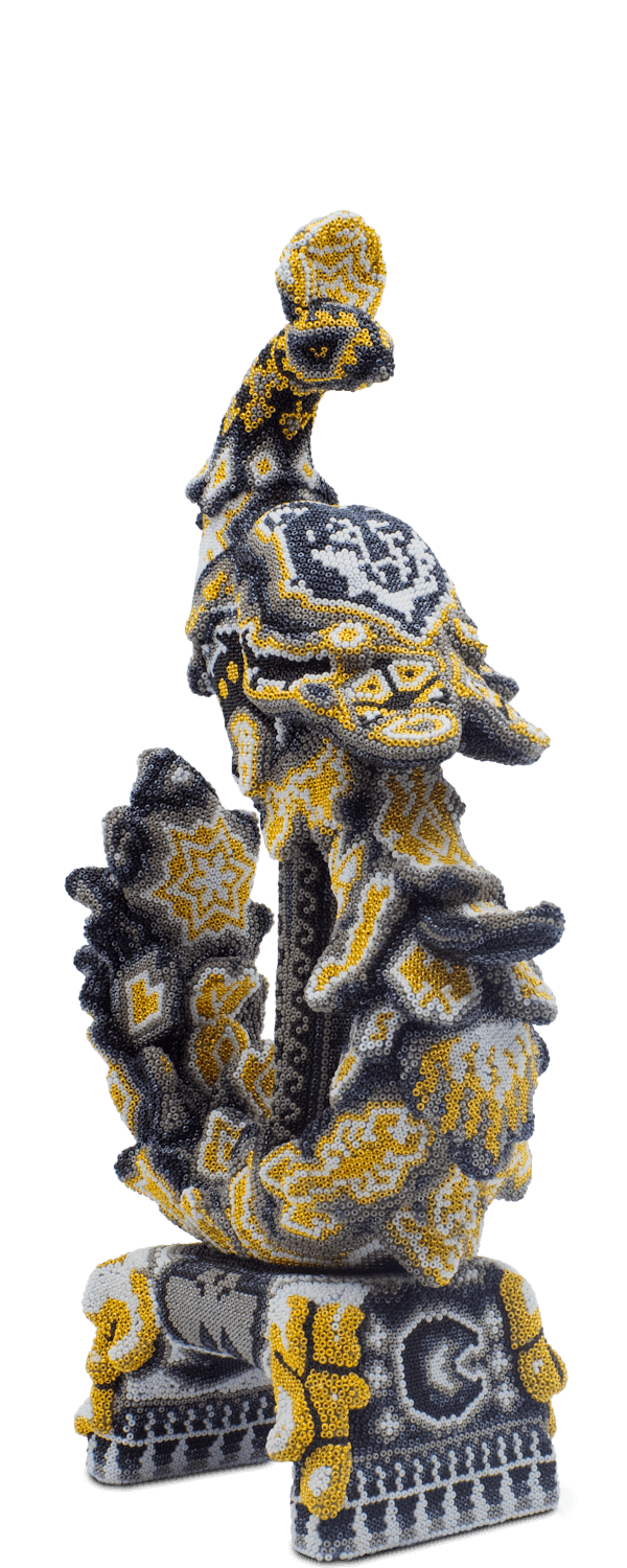 Phoenix sculpture covered with gold and black beads