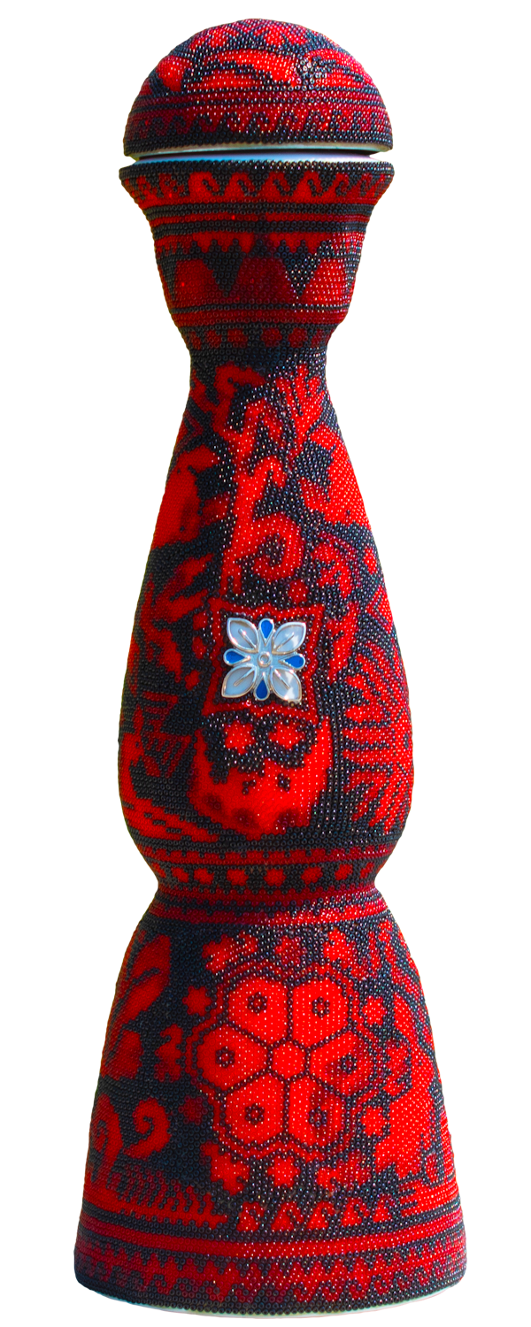 Clase azul tequila bottle covered with colored beads