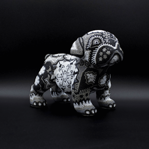 Dog sculpture covered with black and white beads