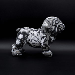 Dog sculpture covered with black and white beads