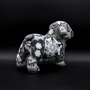Dog sculpture covered with black and white beads