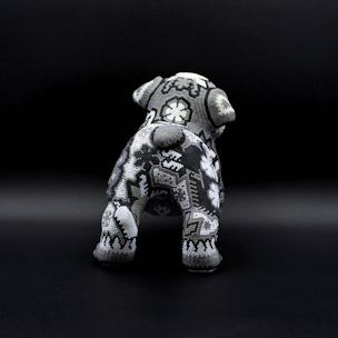 Dog sculpture covered with black and white beads