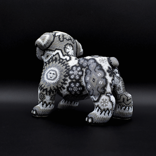 Dog sculpture covered with black and white beads