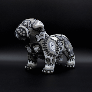 Dog sculpture covered with black and white beads
