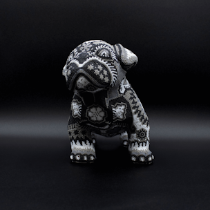 Dog sculpture covered with black and white beads