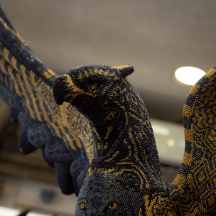 Blue and gold griffin sculpture