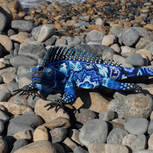 Iguana sculpture covered with blue and white beads